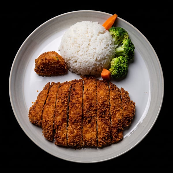 Crispy fried chicken cutlet, white rice, broccoli, and carrots on a light gray plate.